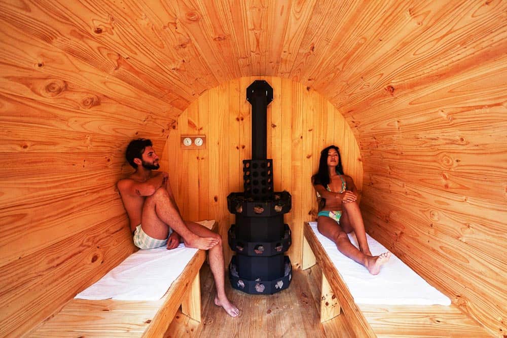 Sauna at Hotel Sacred Valley. A couple in a barrel-shaped sauna