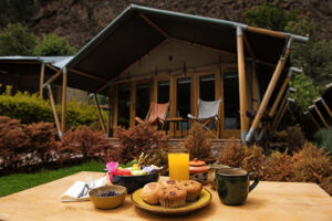 Horizontal image of breakfast brought to a tent at Las Qolqas Eco Lodge
